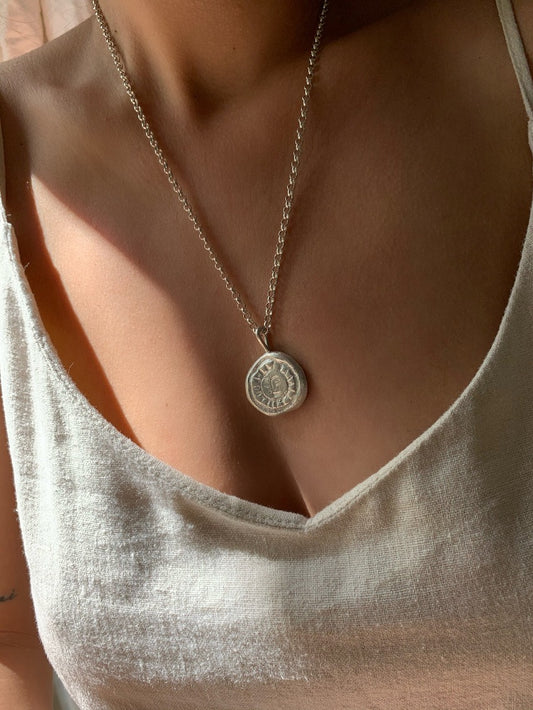 sun coin pendant