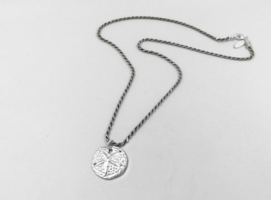 Sand dollar coin on a rope